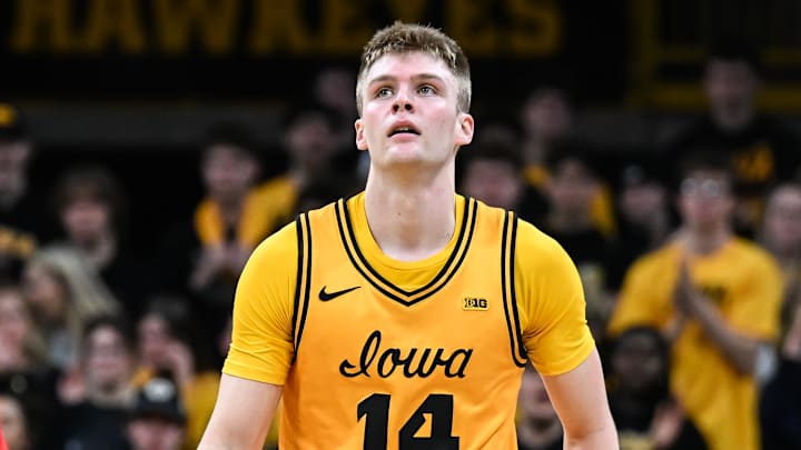 Feb 25, 2026; Iowa City, Iowa, USA; Iowa Hawkeyes guard Bennett Stirtz (14) reacts after being fouled by Ohio State Buckeyes forward Devin Royal (21) during the first half at Carver-Hawkeye Arena. Mandatory Credit: Jeffrey Becker-Imagn Images