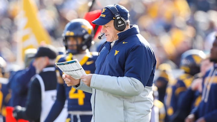 Nov 29, 2025; Morgantown, West Virginia, USA; West Virginia Mountaineers head coach Rich Rodriguez along the sidelines during the first quarter against the Texas Tech Red Raiders at Milan Puskar Stadium. Mandatory Credit: Ben Queen-Imagn Images