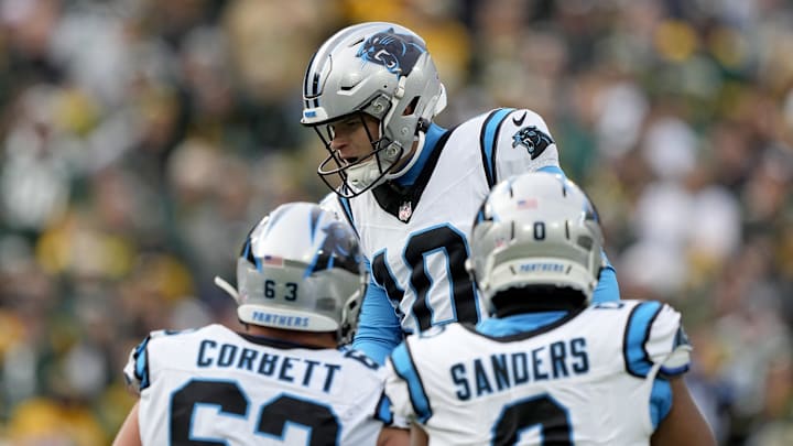 Nov 2, 2025; Green Bay, Wisconsin, USA; Carolina Panthers place kicker Ryan Fitzgerald (10) celebrates with teammates after kicking a game-winning field goal during the fourth quarter against the Green Bay Packers at Lambeau Field. Mandatory Credit: Jeff Hanisch-Imagn Images