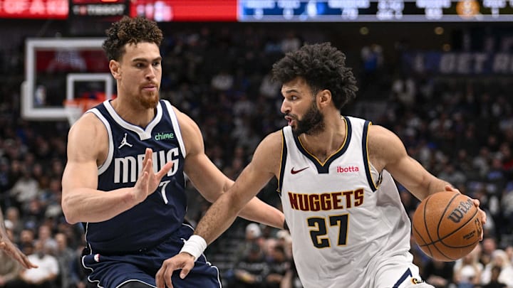 Jan 14, 2025; Dallas, Texas, USA; Denver Nuggets guard Jamal Murray (27) drives to the basket past Dallas Mavericks center Dwight Powell (7) during the second half at the American Airlines Center. Mandatory Credit: Jerome Miron-Imagn Images