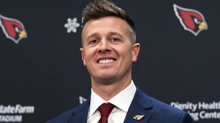 Feb 3, 2026; Tempe, AZ, USA; Arizona Cardinals head coach Mike LaFleur poses for photos at the introductory press conference at the Cardinals training facility. Mandatory Credit: Mark J. Rebilas-Imagn Images