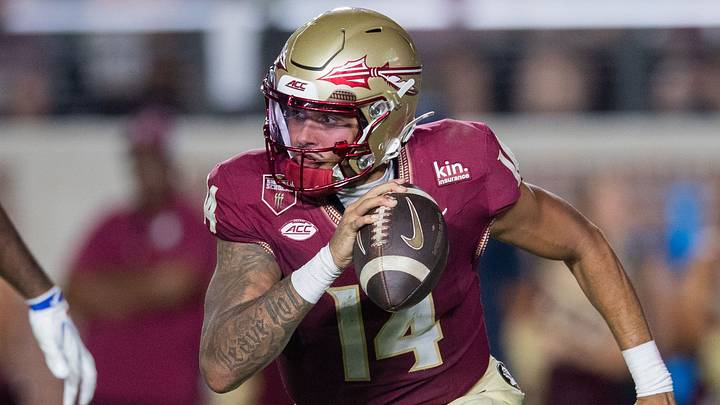 Florida State Seminoles quarterback Ashton Daniels (14) runs the ball. The SMU Mustangs lead the Florida State Seminoles 17-10 at the end of the first half Monday, Sept. 7, 2026. Florida State Seminoles quarterback Ashton Daniels (14) runs the ball. The SMU Mustangs lead the Florida State Seminoles 17-10 at the end of the first half Monday, Sept. 7, 2026.