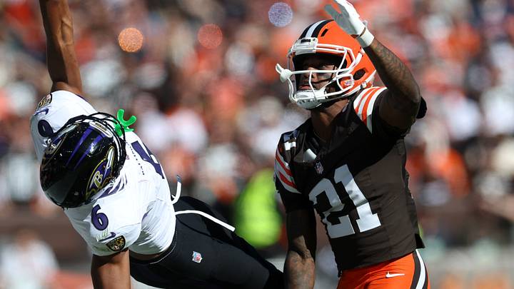 Oct 18, 2026; Cleveland, Ohio, USA;  Baltimore Ravens wide receiver Ja'Kobi Lane (6) attempts to grab a pass under pressure from Cleveland Browns cornerback Denzel Ward (21) in the second quarter at Huntington Bank Field.  Mandatory Credit: Scott Galvin-Imagn Images
