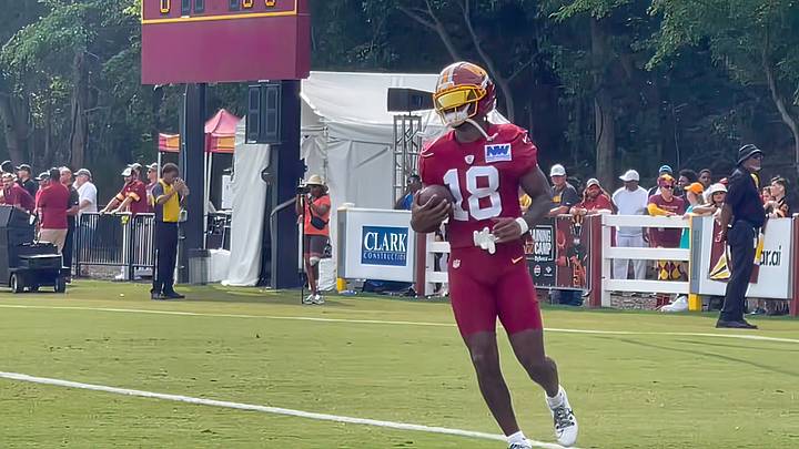 Washington Commanders wide receiver Stefon Diggs secures a catch while warming up before joint practices with the Miami Dolphins at training camp practice in Ashburn, Virginia. Washington Commanders wide receiver Stefon Diggs secures a catch while warming up before joint practices with the Miami Dolphins at training camp practice in Ashburn, Virginia.