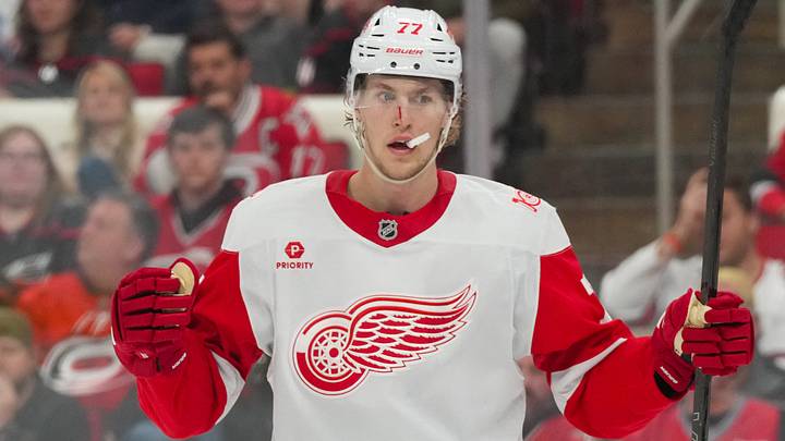 Feb 28, 2026; Raleigh, North Carolina, USA; Detroit Red Wings defenseman Simon Edvinsson (77) celebrates his goal against the Carolina Hurricanes during the second period at Lenovo Center. Mandatory Credit: James Guillory-Imagn Images Feb 28, 2026; Raleigh, North Carolina, USA; Detroit Red Wings defenseman Simon Edvinsson (77) celebrates his goal against the Carolina Hurricanes during the second period at Lenovo Center. Mandatory Credit: James Guillory-Imagn Images
