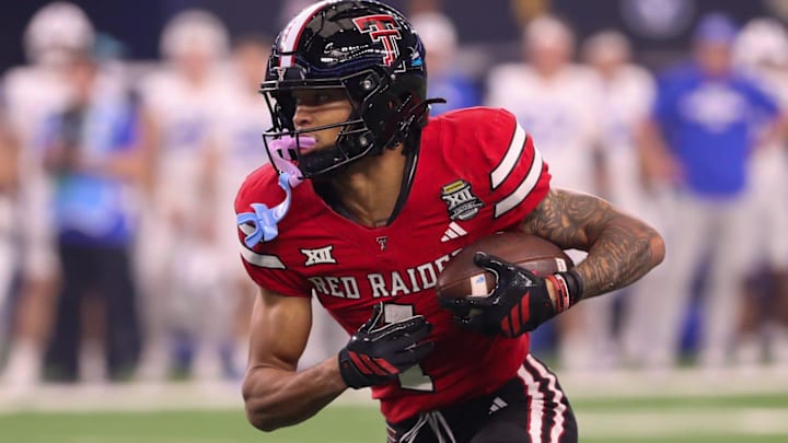 Texas Tech's Reggie Virgil runs after a catch against BYU during the Big 12 Conference championship football game. Texas Tech's Reggie Virgil runs after a catch against BYU during the Big 12 Conference championship football game.