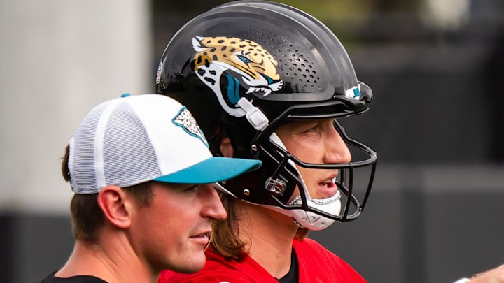 Jacksonville Jaguars offensive coordinator Grant Udinski, left, talks with Jacksonville Jaguars quarterback Trevor Lawrence (16) during the Jacksonville Jaguars’ mandatory minicamp Tuesday June 10, 2025 at the Miller Electric Center in Jacksonville, Fla. [Doug Engle/Florida Times-Union]