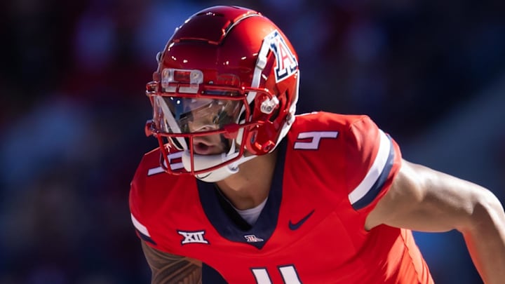 Nov 30, 2024; Tucson, Arizona, USA; Arizona Wildcats wide receiver Tetairoa McMillan (4) against the Arizona State Sun Devils during the Territorial Cup at Arizona Stadium. Mandatory Credit: Mark J. Rebilas-Imagn Images