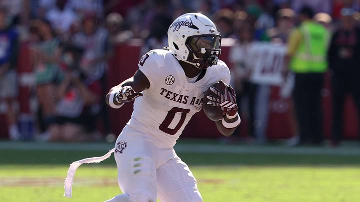 Oct 24, 2026; Tuscaloosa, Alabama, USA;  Texas A&M Aggies running back KJ Edwards (0) runs the ball against the Alabama Crimson Tide during the first half at Saban Field at Bryant-Denny Stadium.  Mandatory Credit: David Leong-Imagn Images