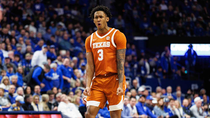 Texas Longhorns forward Dailyn Swain (3) celebrates after center Matas Vokietaitis scores a basket.