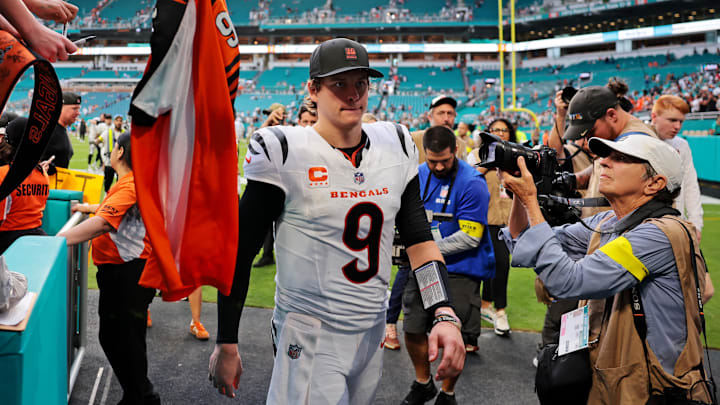 Dec 21, 2025; Miami Gardens, Florida, USA; Fans wave jerseys as Cincinnati Bengals quarterback Joe Burrow (9) enters the tunnel after the game against the Miami Dolphins at Hard Rock Stadium. Mandatory Credit: Sam Navarro-Imagn Images