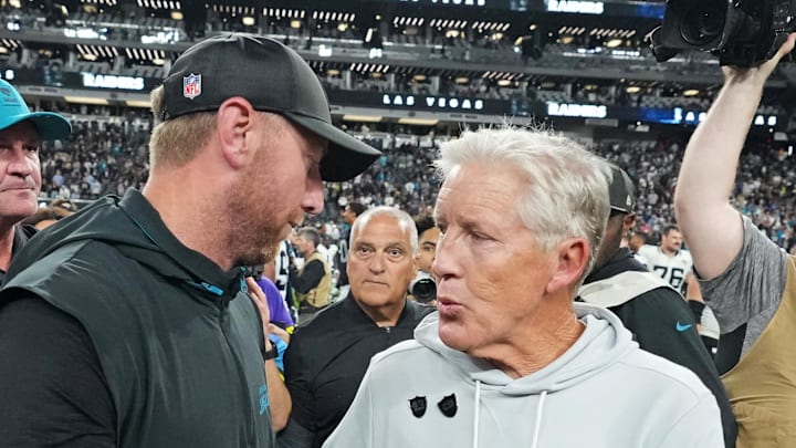 Nov 2, 2025; Paradise, Nevada, USA; The Jacksonville Jaguars head coach Liam Coen and the Las Vegas Raiders head coach Pete Carroll meet after the win against the Las Vegas Raiders at Allegiant Stadium. Mandatory Credit: Kirby Lee-Imagn Images