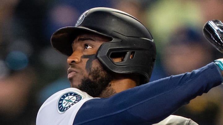 Seattle Mariners right fielder Victor Robles hits a double during a game against the Detroit Tigers on April 2 at T-Mobile Park.