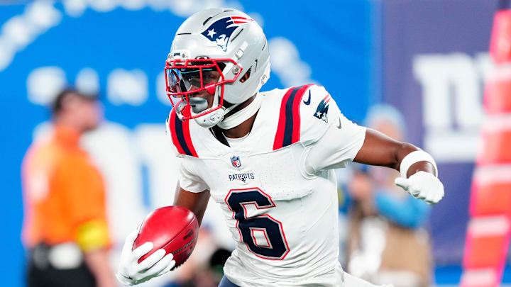 New England Patriots wide receiver Javon Baker (6) runs with the punt return in the first quarter, Thursday, August 21, 2025, in East Rutherford.