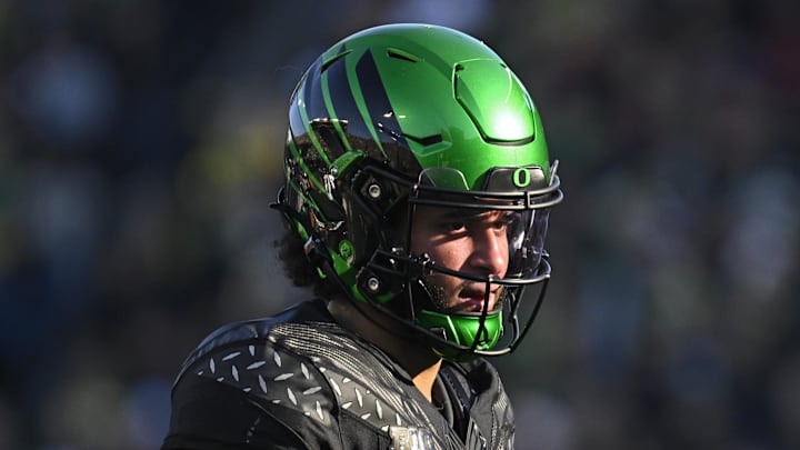Nov 22, 2025; Eugene, Oregon, USA;  Oregon Ducks quarterback Dante Moore (5) looks on during the first half against the Southern California Trojans at Autzen Stadium. Mandatory Credit: Troy Wayrynen-Imagn Images