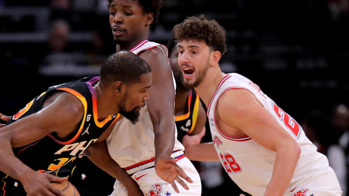 Dec 27, 2023; Houston, Texas, USA; Phoenix Suns forward Kevin Durant (35) handles the ball against Houston Rockets center Alperen Sengun (28) during the second quarter at Toyota Center. Mandatory Credit: Erik Williams-Imagn Images