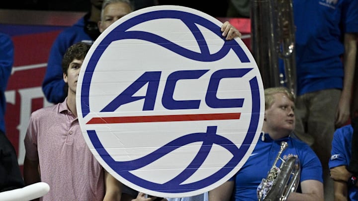 Feb 17, 2026; Dallas, Texas, USA; A fan holds up an ACC logo banner during the second half of the game between the SMU Mustangs and the Louisville Cardinals at Moody Coliseum. Mandatory Credit: Jerome Miron-Imagn Images