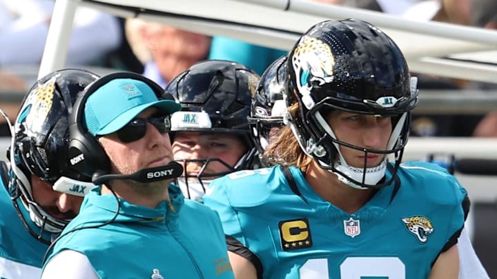 Dec 14, 2025; Jacksonville, Florida, USA; Jacksonville Jaguars head coach Liam Coen stands with quarterback Trevor Lawrence (16) during the second quarter against the New York Jets at EverBank Stadium. Mandatory Credit: Morgan Tencza-Imagn Images