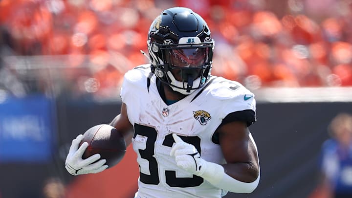 Sep 14, 2025; Cincinnati, Ohio, USA;  Jacksonville Jaguars running back Bhayshul Tuten (33) runs the ball during the first quarter against the Cincinnati Bengals at Paycor Stadium. Mandatory Credit: Joseph Maiorana-Imagn Images