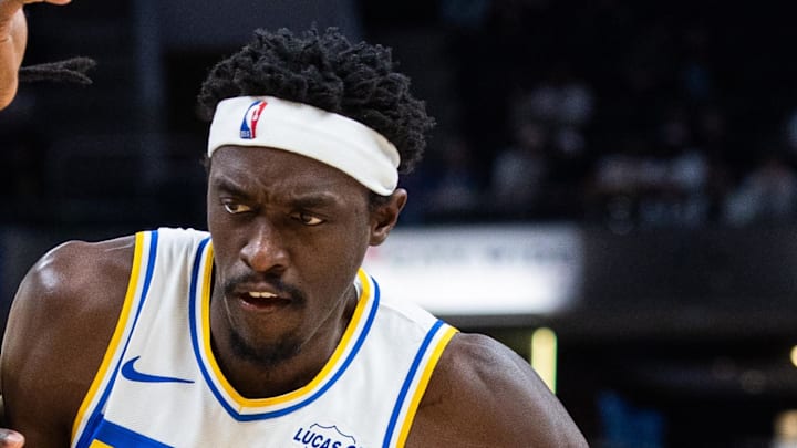 Indiana Pacers forward Pascal Siakam dribbles the ball while Washington Wizards forward Jamir Watkins defends.