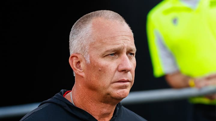 Aug 28, 2025; Raleigh, North Carolina, USA; North Carolina State Wolfpack head coach Dave Doeren walks out during the warmups prior to the game against East Carolina Pirates at Carter-Finley Stadium. Mandatory Credit: Jaylynn Nash-Imagn Images Aug 28, 2025; Raleigh, North Carolina, USA; North Carolina State Wolfpack head coach Dave Doeren walks out during the warmups prior to the game against East Carolina Pirates at Carter-Finley Stadium. Mandatory Credit: Jaylynn Nash-Imagn Images
