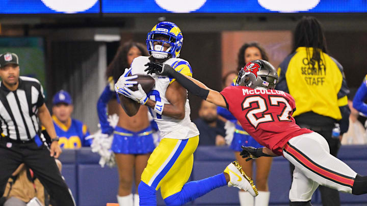 Nov 23, 2025; Inglewood, California, USA; Los Angeles Rams wide receiver Davante Adams (17) catches a twenty-four touchdown pass thrown by quarterback Matthew Stafford (not pictured) against Tampa Bay Buccaneers cornerback Zyon McCollum (27) during the second quarter at SoFi Stadium.  Mandatory Credit: Jayne Kamin-Oncea-Imagn Images