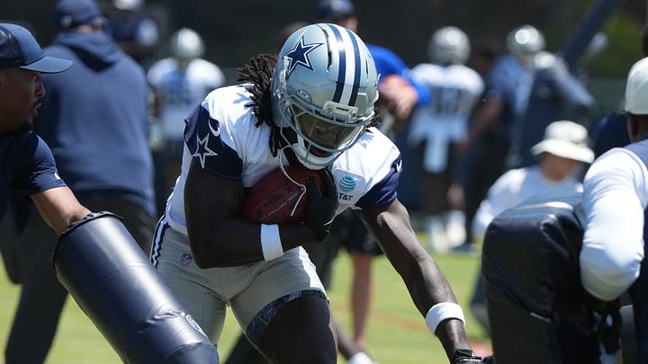 Dallas Cowboys running back Israel Abanikanda carries the ball at training camp at River Ridge Playing Fields. Dallas Cowboys running back Israel Abanikanda carries the ball at training camp at River Ridge Playing Fields.