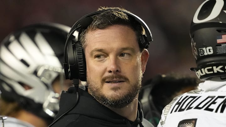 Nov 16, 2024; Madison, Wisconsin, USA;  Oregon Ducks head coach Dan Lanning looks on during the third quarter against the Wisconsin Badgers at Camp Randall Stadium. Mandatory Credit: Jeff Hanisch-Imagn Images