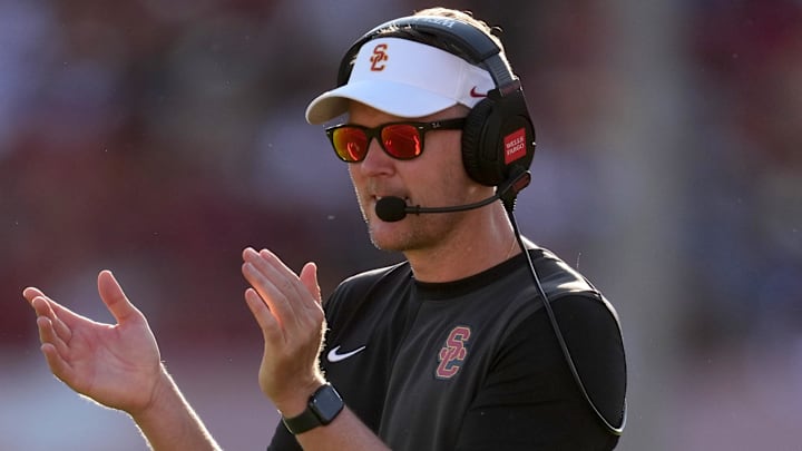 Aug 30, 2025; Los Angeles, California, USA; Southern California Trojans head coach Lincoln Riley watches from the sidelines against the Missouri State Bears in the first half at United Airlines Field at Los Angeles Memorial Coliseum. Mandatory Credit: Kirby Lee-Imagn Images