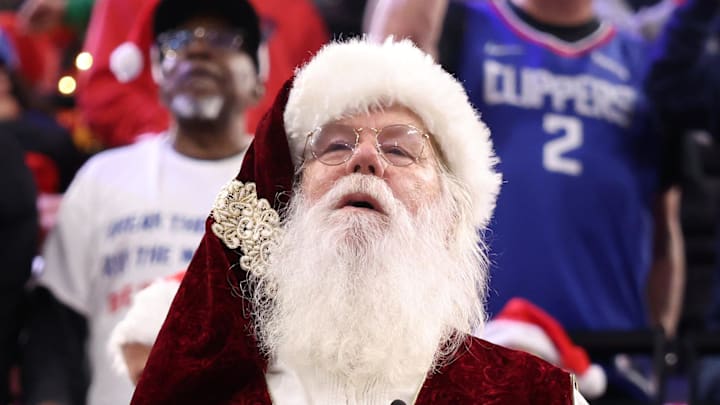 Dec 23, 2025; Inglewood, California, USA;  A fan dressed as Santa Claus attends an NBA game between the Los Angeles Clippers and the Houston Rockets at Intuit Dome. Mandatory Credit: Kiyoshi Mio-Imagn Images