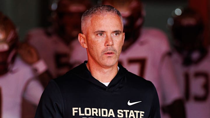 Nov 29, 2025; Gainesville, Florida, USA; Florida State Seminoles head coach Mike Norvell walks out of the tunnel before a game against the Florida Gators at Ben Hill Griffin Stadium. Mandatory Credit: Matt Pendleton-Imagn Images