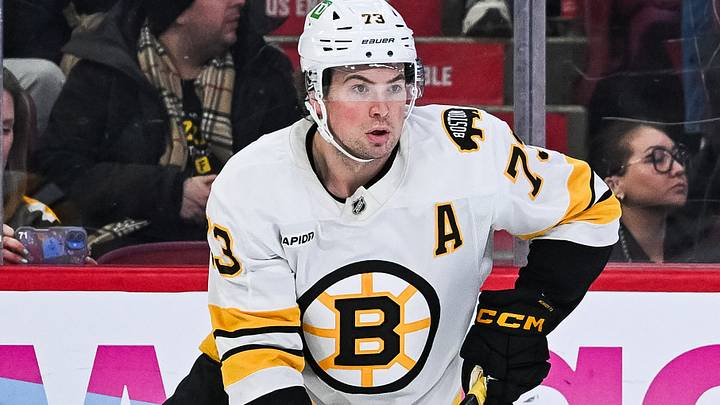 Mar 17, 2026; Montreal, Quebec, CAN; Boston Bruins defenseman Charlie McAvoy (73) plays the puck against the Montreal Canadiens during overtime at Bell Centre. Mandatory Credit: David Kirouac-Imagn Images Mar 17, 2026; Montreal, Quebec, CAN; Boston Bruins defenseman Charlie McAvoy (73) plays the puck against the Montreal Canadiens during overtime at Bell Centre. Mandatory Credit: David Kirouac-Imagn Images