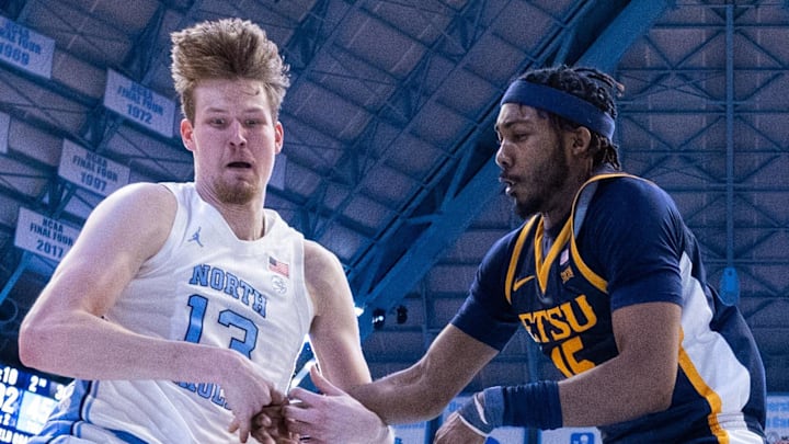 Dec 16, 2025; Chapel Hill, North Carolina, USA; North Carolina Tar Heels center Henri Veesaar (13) and ETSU Buccaneers forward Cam Morris III (15) battle for the ball during the second half at Dean E. Smith Center. Mandatory Credit: Scott Kinser-Imagn Images Dec 16, 2025; Chapel Hill, North Carolina, USA; North Carolina Tar Heels center Henri Veesaar (13) and ETSU Buccaneers forward Cam Morris III (15) battle for the ball during the second half at Dean E. Smith Center. Mandatory Credit: Scott Kinser-Imagn Images