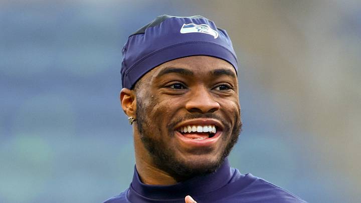 Seattle Seahawks quarterback Jalen Milroe warms up