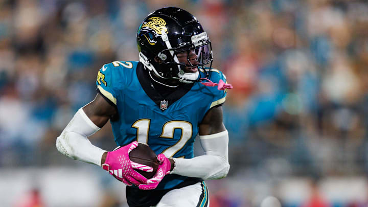 Oct 6, 2025; Jacksonville, Florida, USA; Jacksonville Jaguars wide receiver Travis Hunter (12) runs the ball against the Kansas City Chiefs during the second half at EverBank Stadium. Mandatory Credit: Morgan Tencza-Imagn Images
