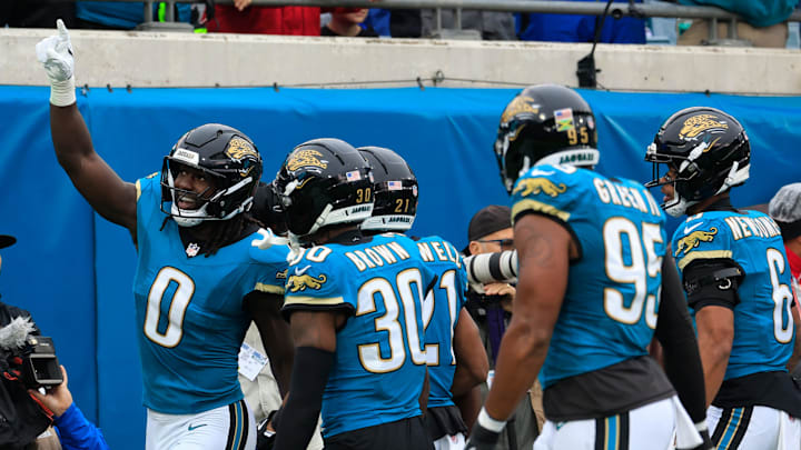 Jacksonville Jaguars linebacker Devin Lloyd (0) celebrates his interception during the first quarter of an NFL football game at EverBank Stadium, Sunday, Dec. 7, 2025, in Jacksonville, Fla. The Jaguars defeated the Colts 36-19.