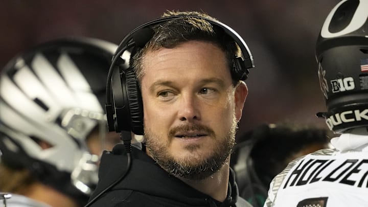 Nov 16, 2024; Madison, Wisconsin, USA;  Oregon Ducks head coach Dan Lanning looks on during the third quarter against the Wisconsin Badgers at Camp Randall Stadium. 