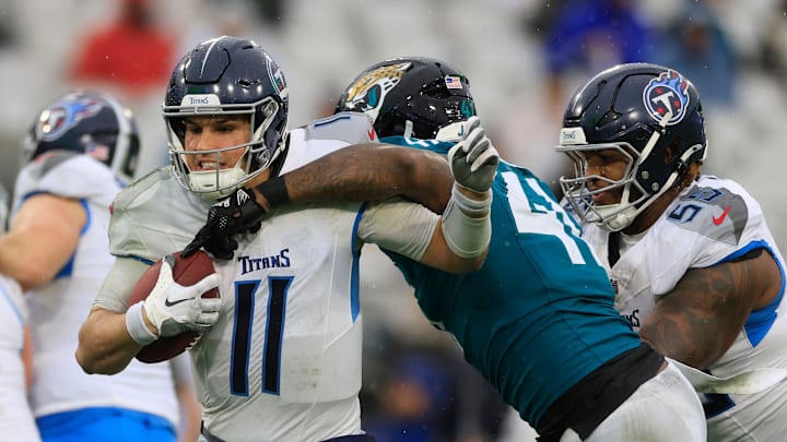 Jacksonville Jaguars defensive end Josh Hines-Allen (41) forces a fumble on Tennessee Titans quarterback Mason Rudolph (11) that was recovered by the offense during the second quarter of an NFL football matchup Sunday, Dec. 29, 2024 at EverBank Stadium in Jacksonville, Fla. [Corey Perrine/Florida Times-Union]