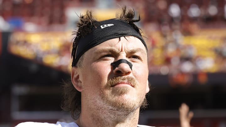 Washington Commanders tight end John Bates walks off the field after the game against the New York Giants. Washington Commanders tight end John Bates walks off the field after the game against the New York Giants.