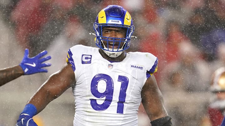 Dec 12, 2024; Santa Clara, California, USA; Los Angeles Rams defensive tackle Kobie Turner (91) reacts after recording a sack against the San Francisco 49ers in the second quarter at Levi's Stadium. Mandatory Credit: Cary Edmondson-Imagn Images Dec 12, 2024; Santa Clara, California, USA; Los Angeles Rams defensive tackle Kobie Turner (91) reacts after recording a sack against the San Francisco 49ers in the second quarter at Levi's Stadium. Mandatory Credit: Cary Edmondson-Imagn Images