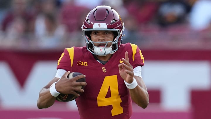 Aug 30, 2025; Los Angeles, California, USA; Southern California Trojans quarterback Husan Longstreet (4) carries the ball against the Missouri State Bears in the second half at United Airlines Field at Los Angeles Memorial Coliseum. Mandatory Credit: Kirby Lee-Imagn Images