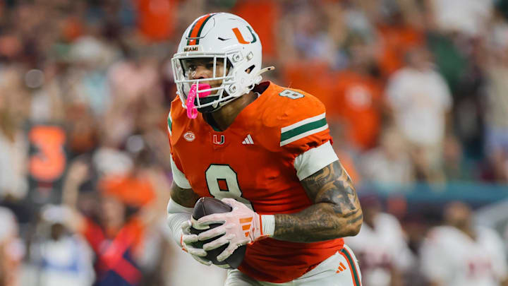 Sep 27, 2024; Miami Gardens, Florida, USA; Miami Hurricanes tight end Elijah Arroyo (8) runs with the football for a touchdown against the Virginia Tech Hokies during the first quarter at Hard Rock Stadium.