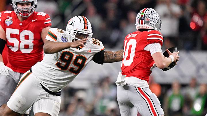 Dec 31, 2025; Arlington, TX, USA; Miami Hurricanes defensive line Ahmad Moten Sr. (99) attempts to sack Ohio State Buckeyes quarterback Julian Sayin (10) in the second quarter during the 2025 Cotton Bowl and quarterfinal game of the College Football Playoff at AT&T Stadium. Mandatory Credit: Jerome Miron-Imagn Images