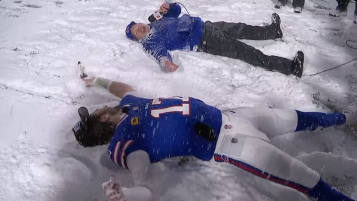 Buffalo Bills QB Josh Allen and coach Sean McDermott do snow angels after their Week 13 win. Buffalo Bills QB Josh Allen and coach Sean McDermott do snow angels after their Week 13 win.