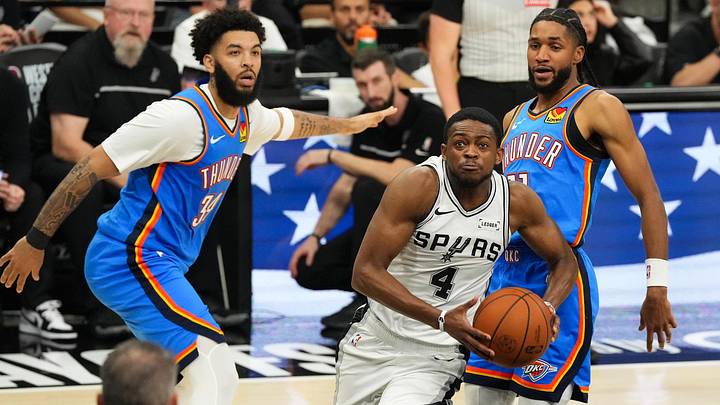 May 24, 2026; San Antonio, Texas, USA; San Antonio Spurs guard De'Aaron Fox (4) drives the ball past Oklahoma City Thunder guard Isaiah Joe (11) in the fourth quarter during Game 4 of the Western Conference Finals for the 2026 NBA Playoffs at Frost Bank Center. May 24, 2026; San Antonio, Texas, USA; San Antonio Spurs guard De'Aaron Fox (4) drives the ball past Oklahoma City Thunder guard Isaiah Joe (11) in the fourth quarter during Game 4 of the Western Conference Finals for the 2026 NBA Playoffs at Frost Bank Center.