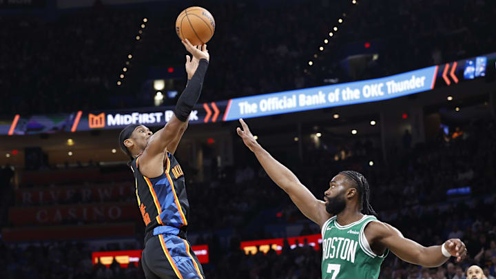 Jan 5, 2025; Oklahoma City, Oklahoma, USA; Oklahoma City Thunder guard Shai Gilgeous-Alexander (2) shoots the ball over Boston Celtics guard Jaylen Brown (7) during the fourth quarter at Paycom Center. Mandatory Credit: Alonzo Adams-Imagn Images
