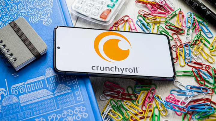 In this photo illustration, a Crunchyroll logo seen...