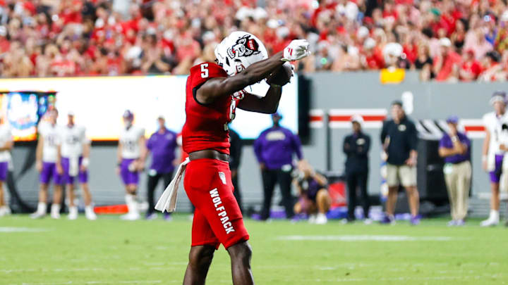 Aug 29, 2024; Raleigh, North Carolina, USA;   North Carolina State Wolfpack wide receiver Noah Rogers (5) celebrates during the first half of the game against Western Carolina Catamounts at Carter-Finley Stadium. Mandatory Credit: Jaylynn Nash-Imagn Images