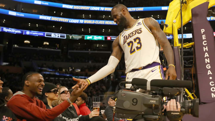 Nov 19, 2023; Los Angeles, California, USA;  Los Angeles Lakers forward LeBron James (23) daps up son Bronny James.