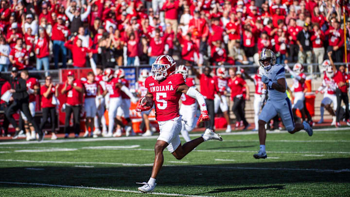 Indiana cornerback D'Angelo Ponds (5) returns and interception for a touchdown against Washington. Indiana cornerback D'Angelo Ponds (5) returns and interception for a touchdown against Washington.